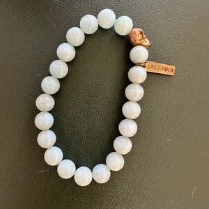Rivieras & Rocks Aquamarine Beaded Bracelet with Bronze Skull Charm – Unisex